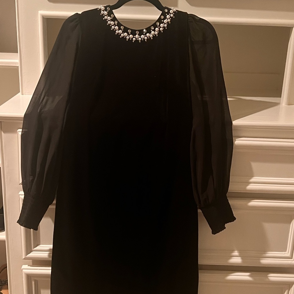 Elegant Black Dress with Embellished Neckline